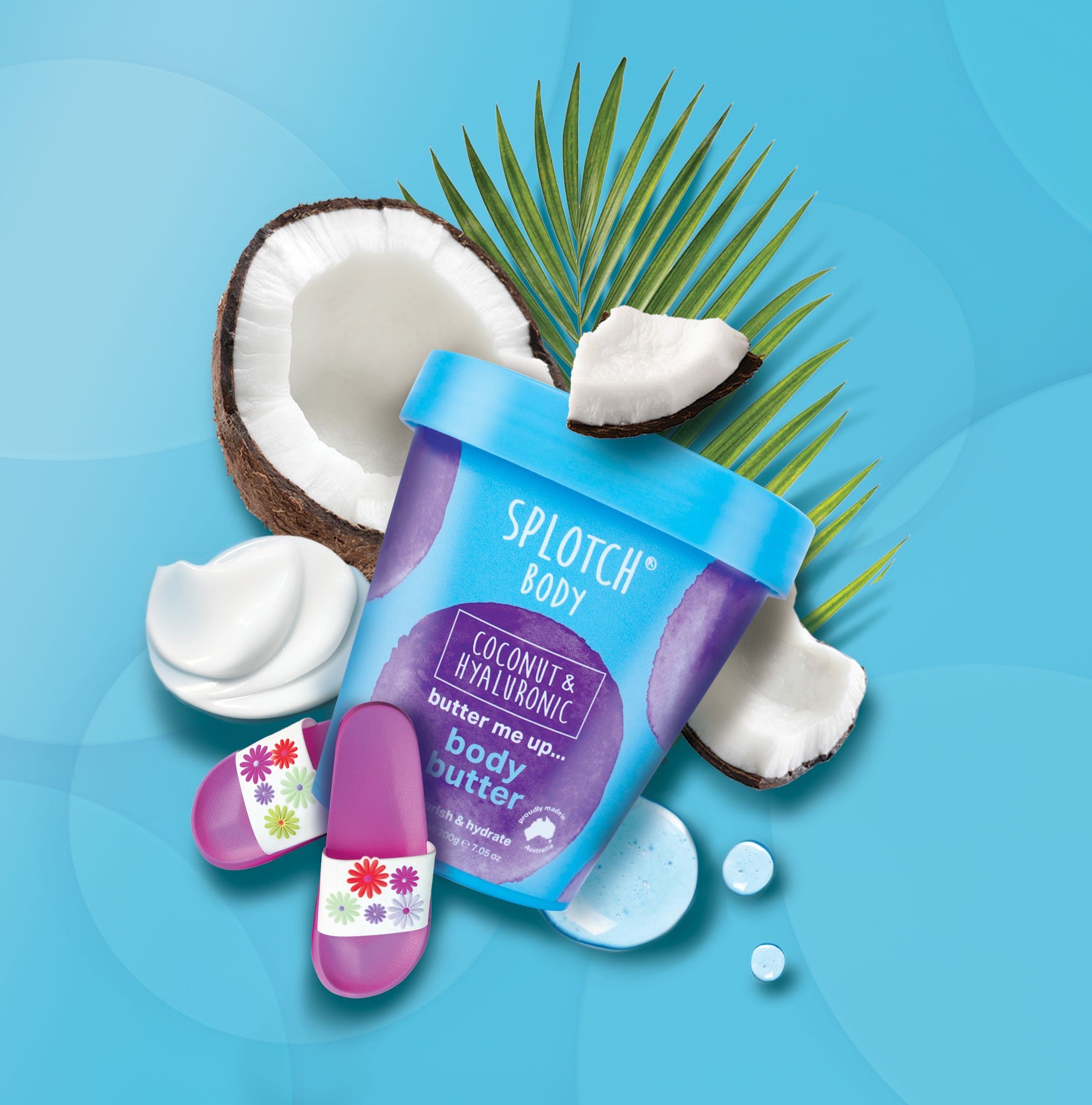 Splotch Body coconut and hyaluronic body butter with coconuts and palm leaves on a blue background