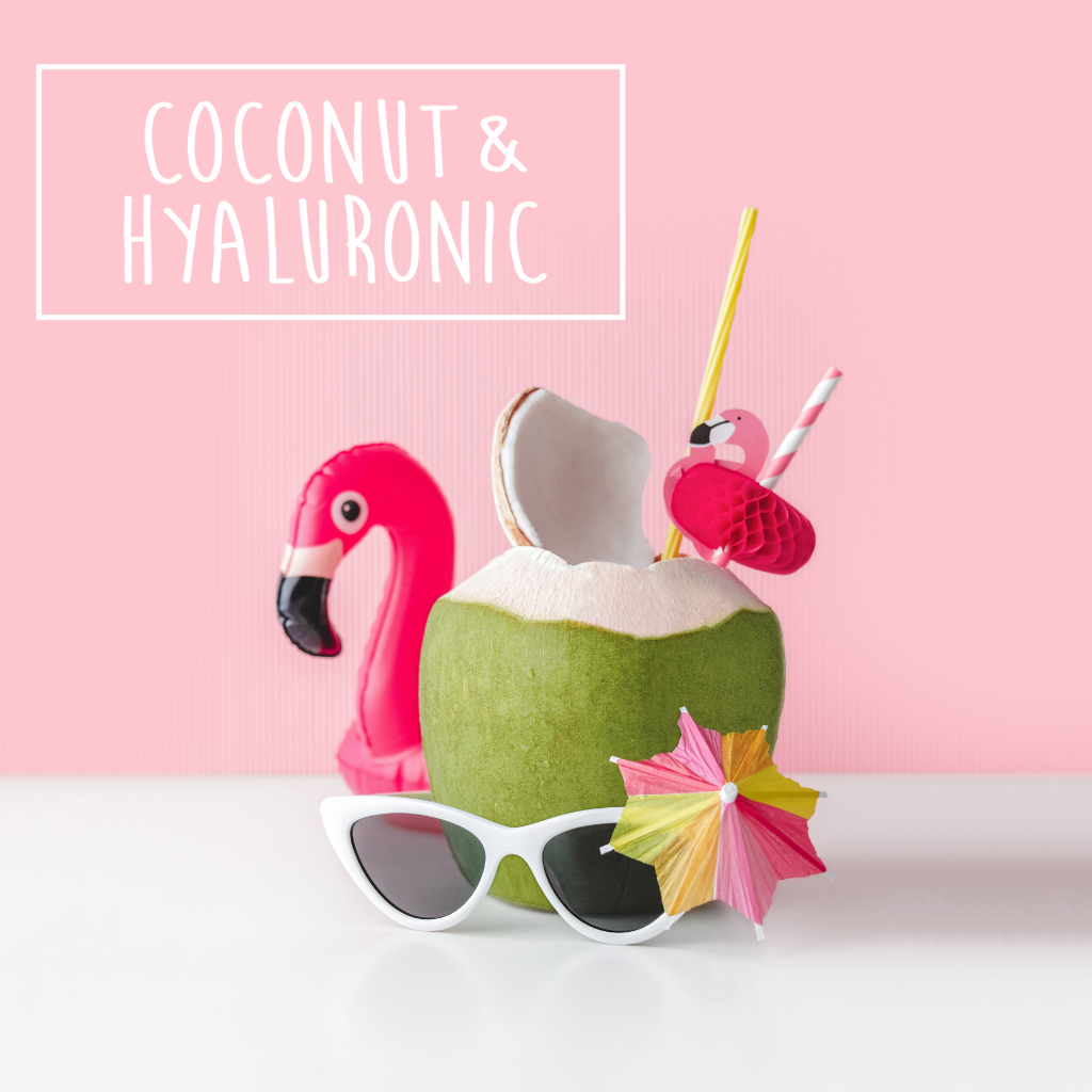 A tropical scene features a fresh green coconut with a pink flamingo straw and cocktail umbrella, accompanied by white sunglasses. A white box in the corner contains the text "COCONUT & HYALURONIC".